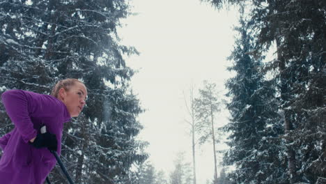 DOLLY-IN-Attractive-Caucasian-female-skier-catching-breath-after-ski-training.-4K-UHD-60-FPS-SLO-MO